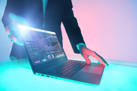 Modern business technologies. The hands of a male business analyst demonstrate indicators reflecting...