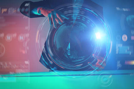 A businessman demonstrates a hologram of global business processes using virtual technologies. Digital holograms, charts. Contemporary digital business technologies.の写真素材