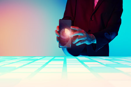 Technologies of the future. A business analyst demonstrates a phone with a special application for managing business.の写真素材