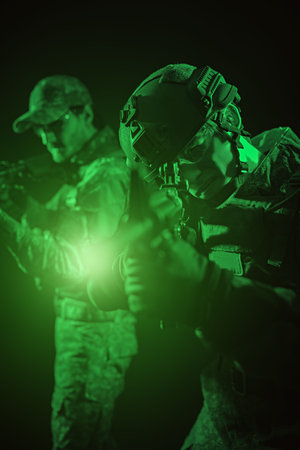 Military and war concept. Two brave soldiers in Protective Combat Uniform with rifles in their hands...