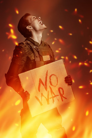 No War concept. Angry soldier in Protective Combat Uniform holds a sign No War screaming furiously...
