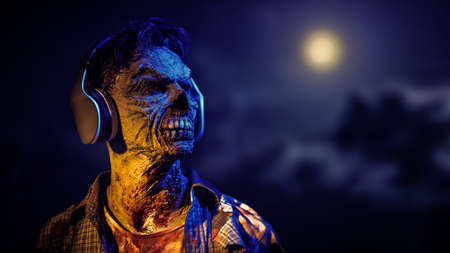 A brutal zombie man listens to music on headphones and looks ahead thoughtfully. Black background. Copy space. Rock music. Life after the apocalypse. Halloween, horror.の写真素材