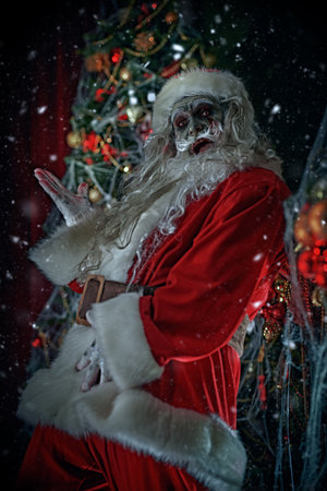 Zombie Santa Claus are dancing and having fun in a room with a Christmas decoration entangled in cobwebs and scares. Christmas and Halloween.の写真素材