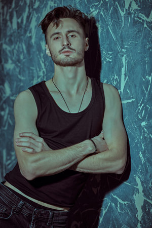 Masculinity. Fashion and male beauty. Portrait of a handsome young brunet man of athletic build...