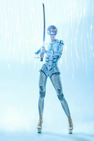 Full-length portrait of a perfect cybergirl warrior in futuristic mirrored glasses and tech overall posing with a sword on a white background. Space tech style. Virtual reality games.の写真素材