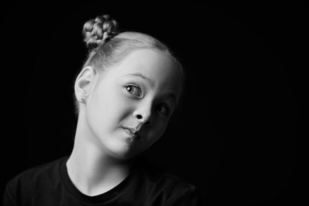 Black and white portrait of a beautiful girl who looks thoughtfully with doubts. Psychological...