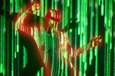 Cyberspace. Virtual reality games. Perfect cyber girl in futuristic glasses and overalls controls digital hologram while standing in neon green light. Digital technologies of the future.の写真素材