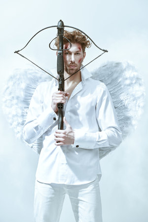 Valentine's Day. A warlike handsome man, the God of love Cupid with wounds on his face, intends to...