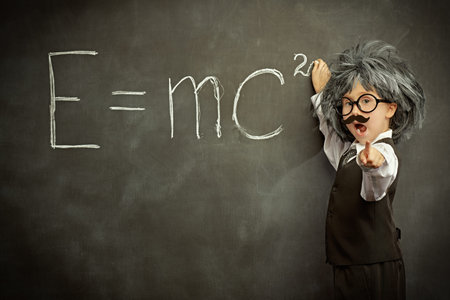 Out of the box thinking. A funny cute child in glasses, with a mustache and in a wig, poses like a...