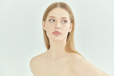 Beauty care and body care cosmetics. Portrait of a beautiful blonde girl on a white studio background. Natural cosmetics. Skincare. Women's beauty and health. Copy space.の写真素材