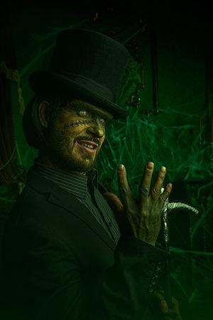 Gothic horror novel. Portrait of a scary mysterious man with huge scars on his face and neck,...