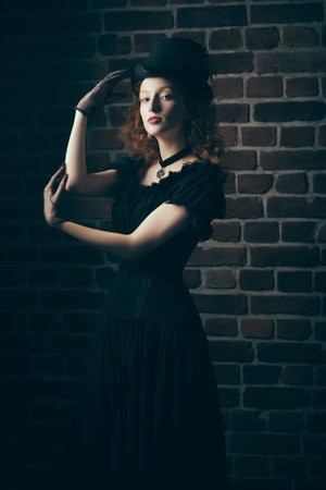 The heroine of the 19th century novel. An attractive young lady with curly red hair, dressed in...