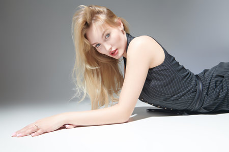 Women's beauty and fashion. Portrait of a gorgeous young woman with blond hair posing in an elegant...