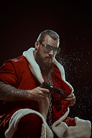 On guard of Christmas and New Year. A brave, muscular Santa Claus in a red fur coat and sunglasses...