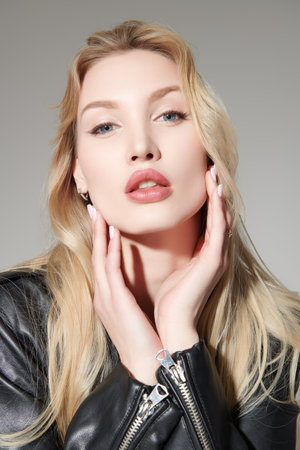 Portrait of a stunning young blonde woman with elegant makeup and sensual lips. Feminine beauty. Makeup and cosmetics. Hair care.の写真素材