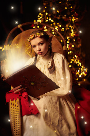 Tales of Christmas. A beautiful elf girl sits in a chair at night in a fabulous Christmas setting...