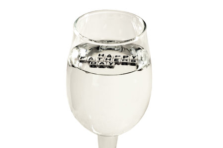 Safe Happy Fathers day with clear water in wine glass  Conceptual image for healthy occasion の写真素材