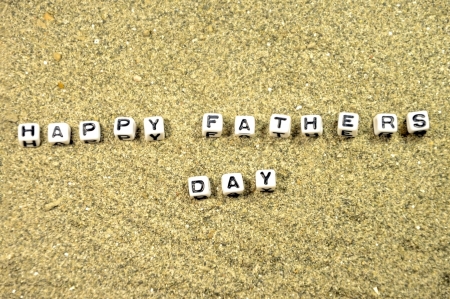 Desert Sand having the letters or cubes of Happy Fathers day Written  の写真素材