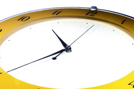Clock in full frame wiht slight tilt and yellow colors  The background is white  の写真素材