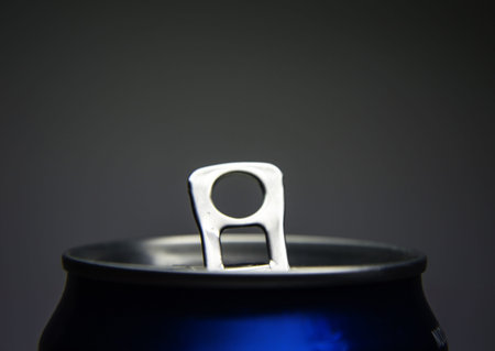 Soda can opened on black grey background  