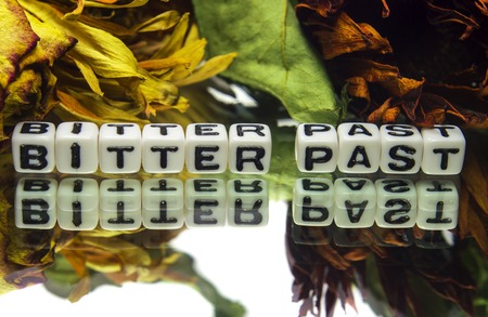 Bitter past with wilted flowers on white background  It also contains text message, の写真素材