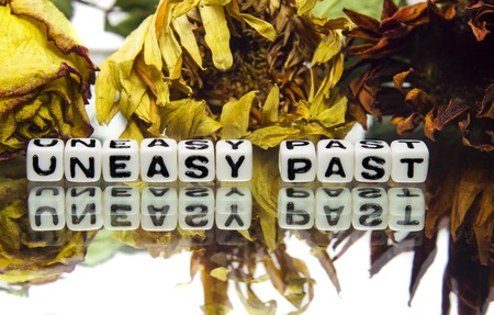 Uneasy past text message with withered flowers の写真素材