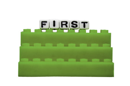 First text on green stairs isolated on white.