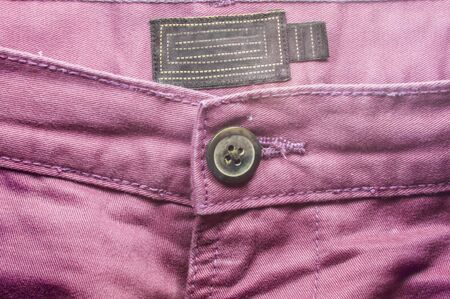 Pink trouser pant front side with a big button. の写真素材
