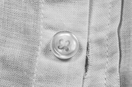 White button on white shirt and other clothes. の写真素材