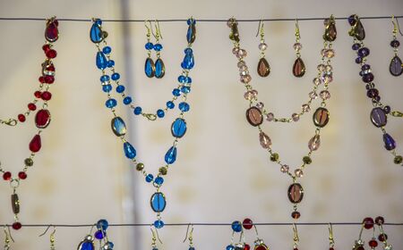 Bead necklaces on sale at a shop.の写真素材