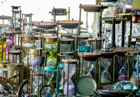 Multiple hourglasses displayed at a store for saleの写真素材
