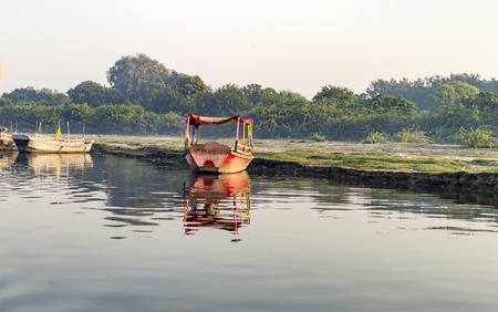 Passenger boat at the side of riverの写真素材