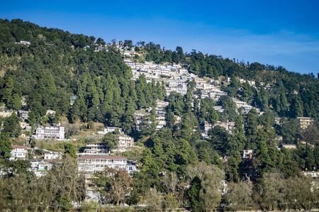 Town on the hills with staired design and white painted architecture.の写真素材