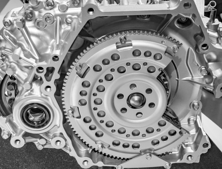 Gears and bearings on car engine model on display.の写真素材