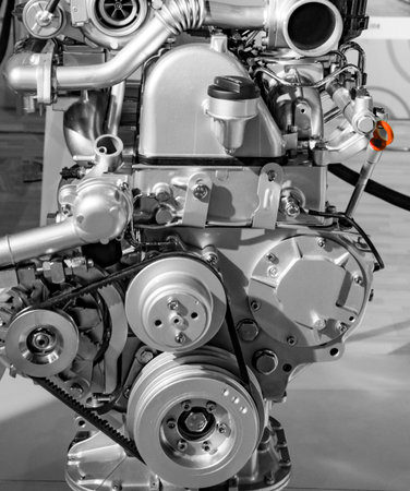 Rotating parts of car engine with belt and other pieces