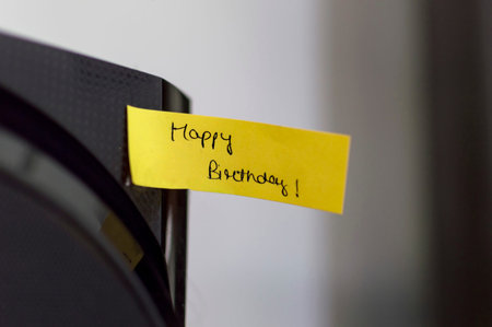 Hand written happy birthday message on paper flag