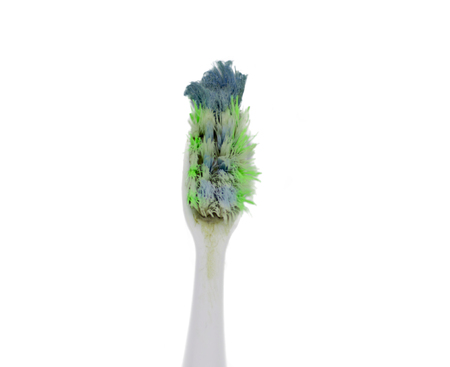 Old and used toothbrush head with threadsの写真素材