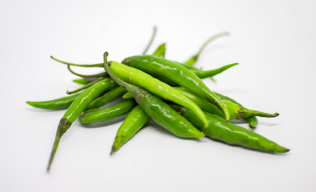 Green chillies on top of each otherの写真素材
