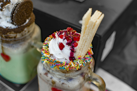 Ice cream and wafers on top of shakeの写真素材