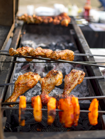 Roasting chicken on steak on fire and grillの写真素材