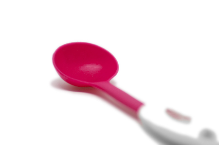Red plastic big spoon for food to serveの写真素材