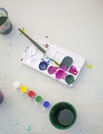 Brushes and watercolor palette with smudgeの写真素材