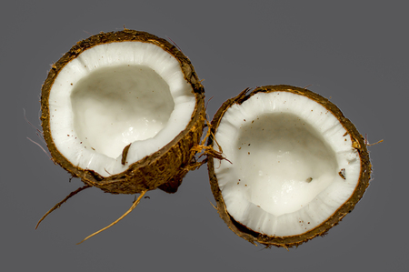 Coconut broken and cut in two partsの写真素材