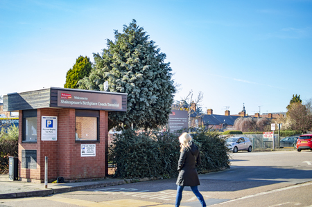 Stratford bus terminal with signboards and trees in the townのeditorial素材