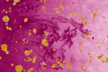Free flowing pink water and Alcohol ink fluid abstract texture fluid art with gold glitter and liquid with shadesの写真素材