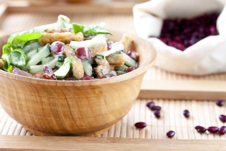 salad with beans, bacon, cucumber and rye croutonsの写真素材