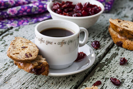 coffee and biscotti with dried cranberries and almondsの写真素材