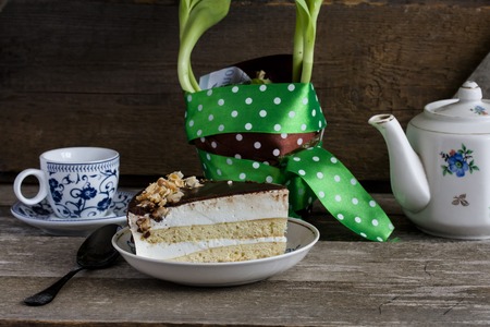 Cake bird's milk with chocolate and coconut on wooden backgroundの写真素材