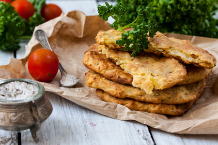 Potato Pancake with parsley on a wooden table
