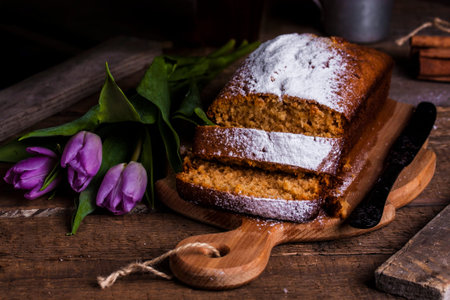cake with honey, coconut and spices on a dark wooden background